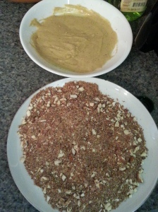 Dip chicken in mustard mixture, then into the almond-.flaxseed meal